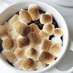 Marshmallow hot chocolate with toasted marshmallows on top, cozy winter drink, dessert, or comforting beverage.