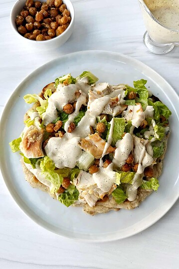 Savory chicken salad on lettuce with creamy dressing and crunchy toppings. Perfect easy lunch or light dinner option.