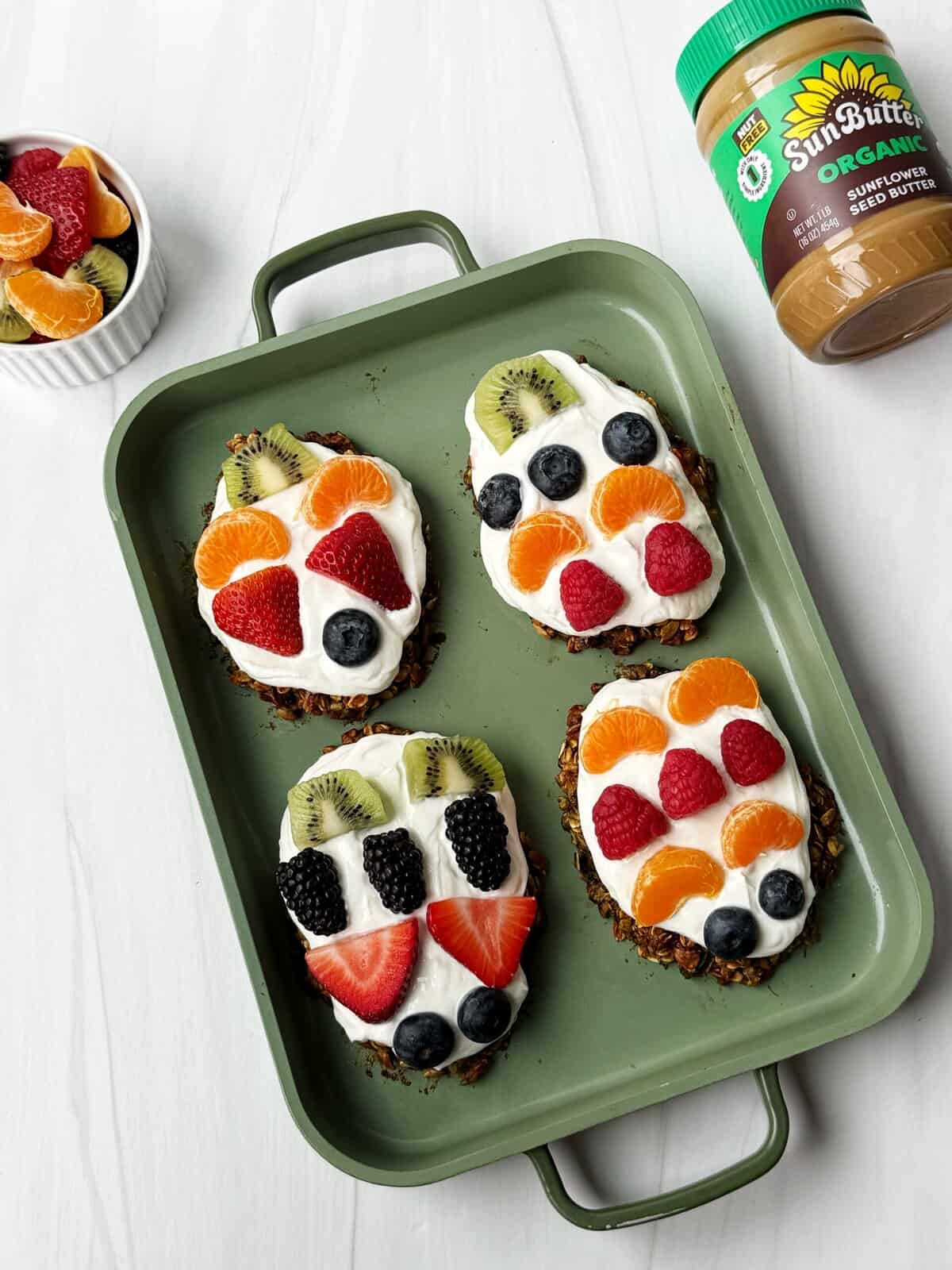 breakfast fruit pizzas with an oatmeal crust topped with yogurt and fruit