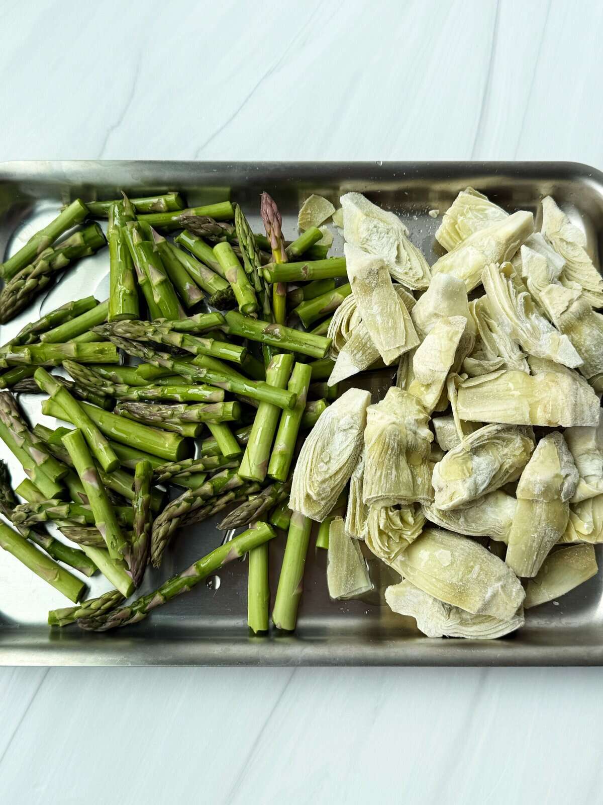 asparagus and artichokes on a pan