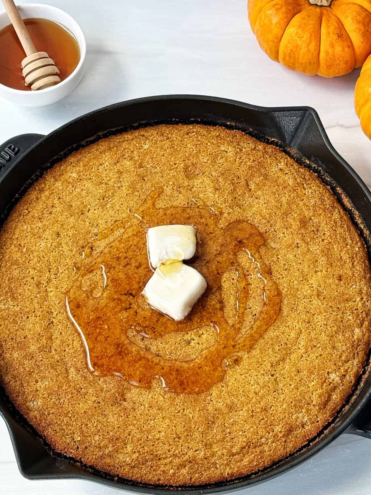 cornbread close up with vegan butter and honey 
