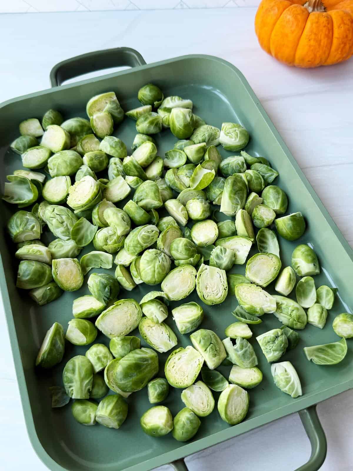 brussels sprouts in pan before going into oven