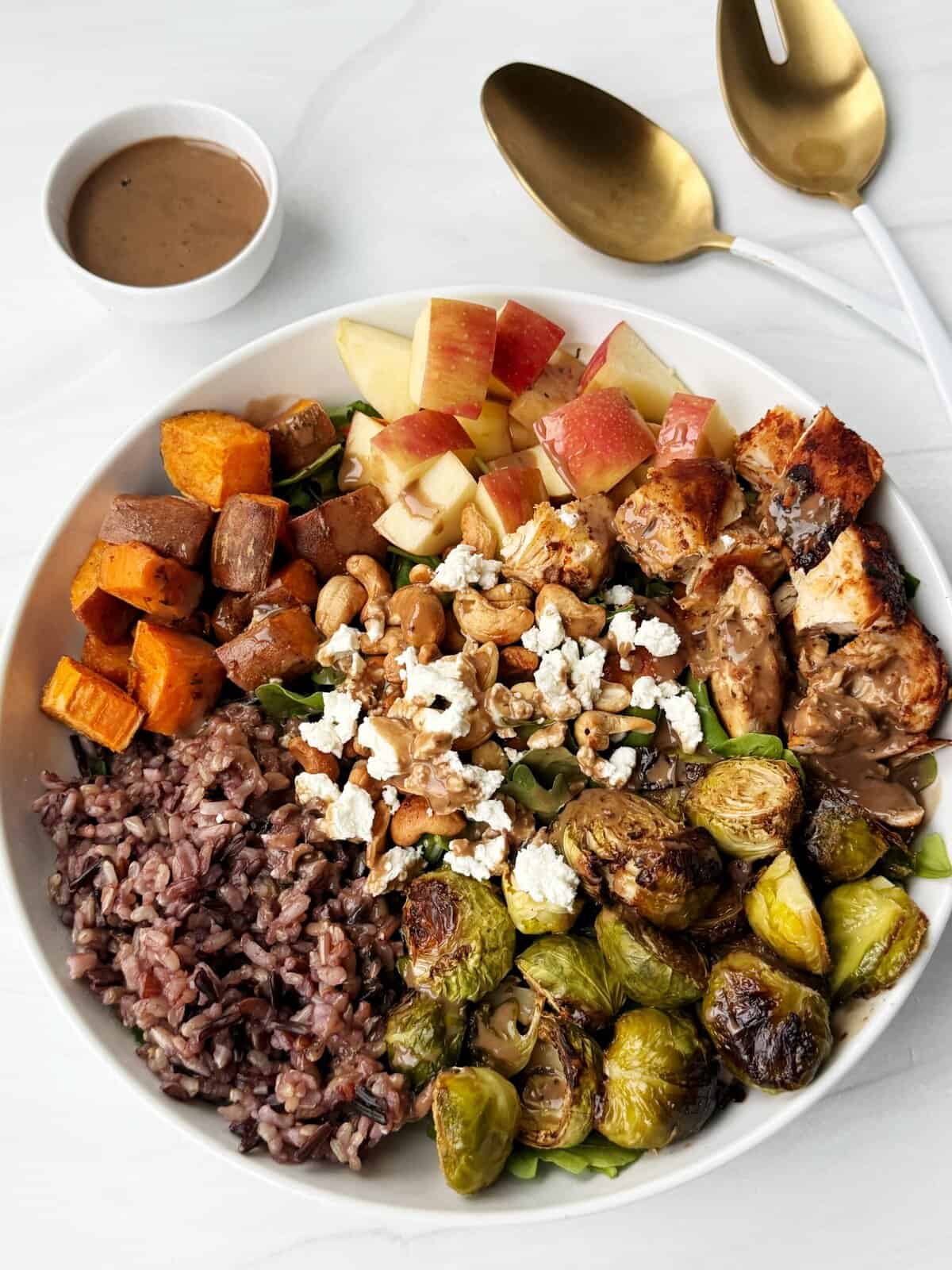 sweet green copycat salad with brussels sprouts, sweet potato, brown rice, cheese and dressing