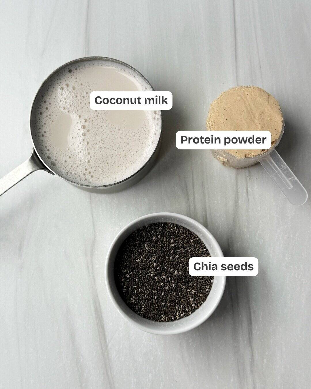 ingredients for chia pudding including coconut milk, protein powder and chia pudding 