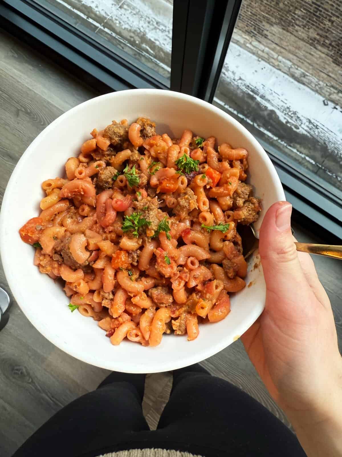 beef bolognese in a bowl with a spoon