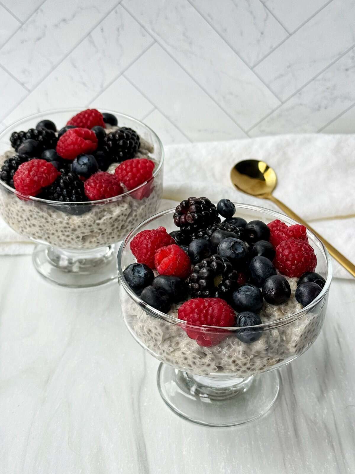 chia seed parfaits topped with berries