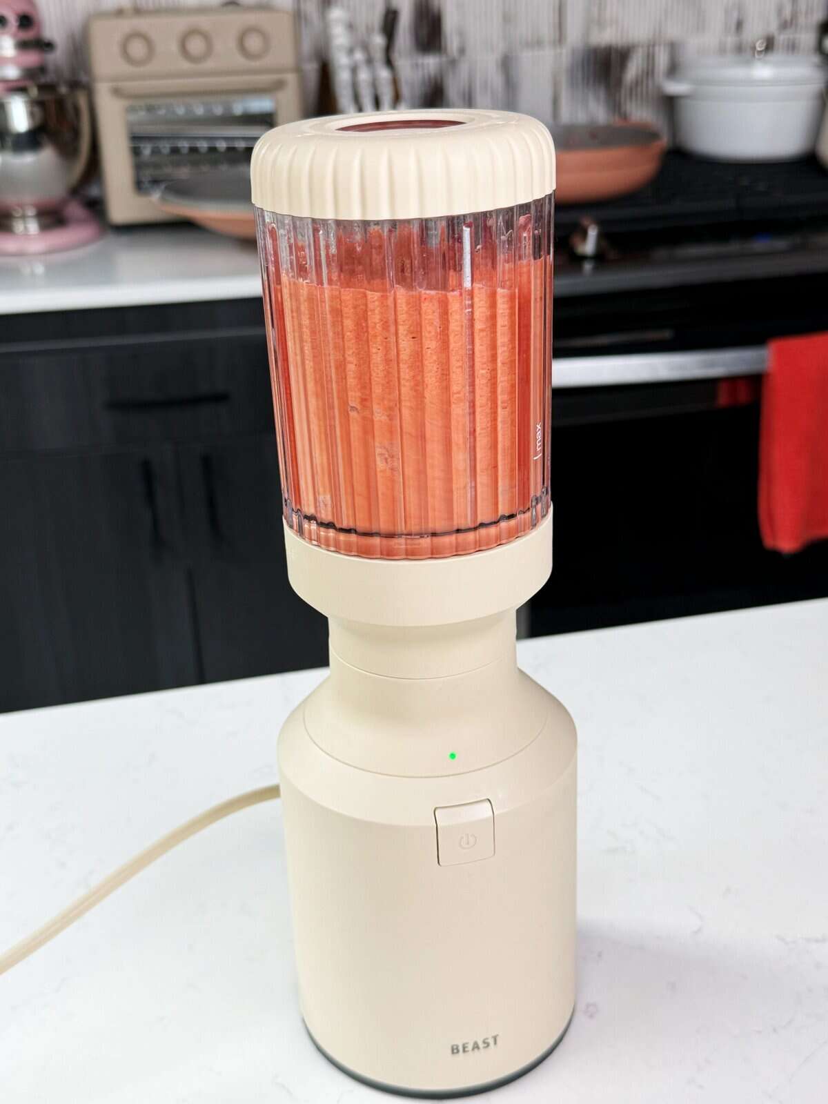 blender with red sauce in it