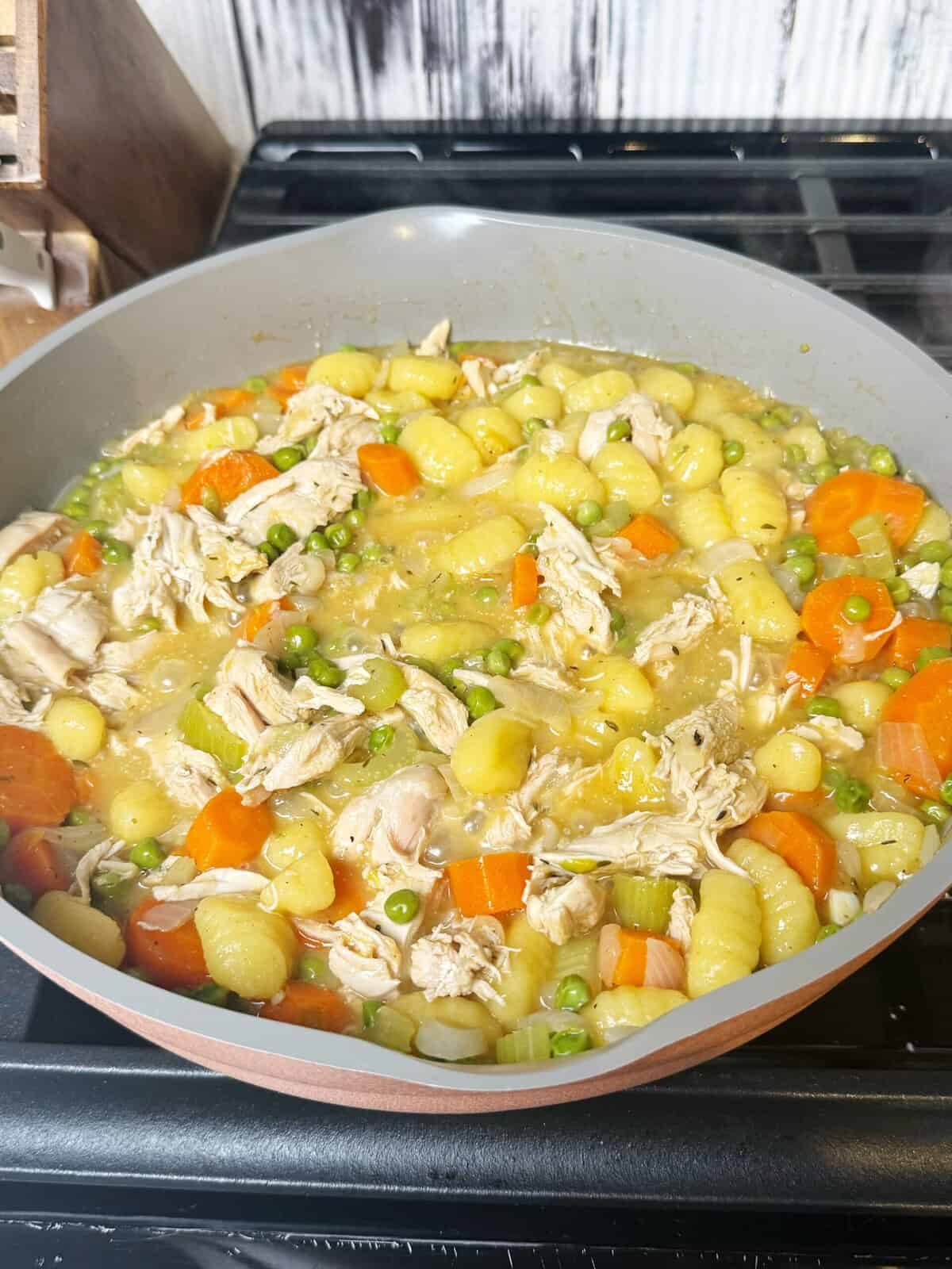 chicken, gnocchi and veggies in a pot 