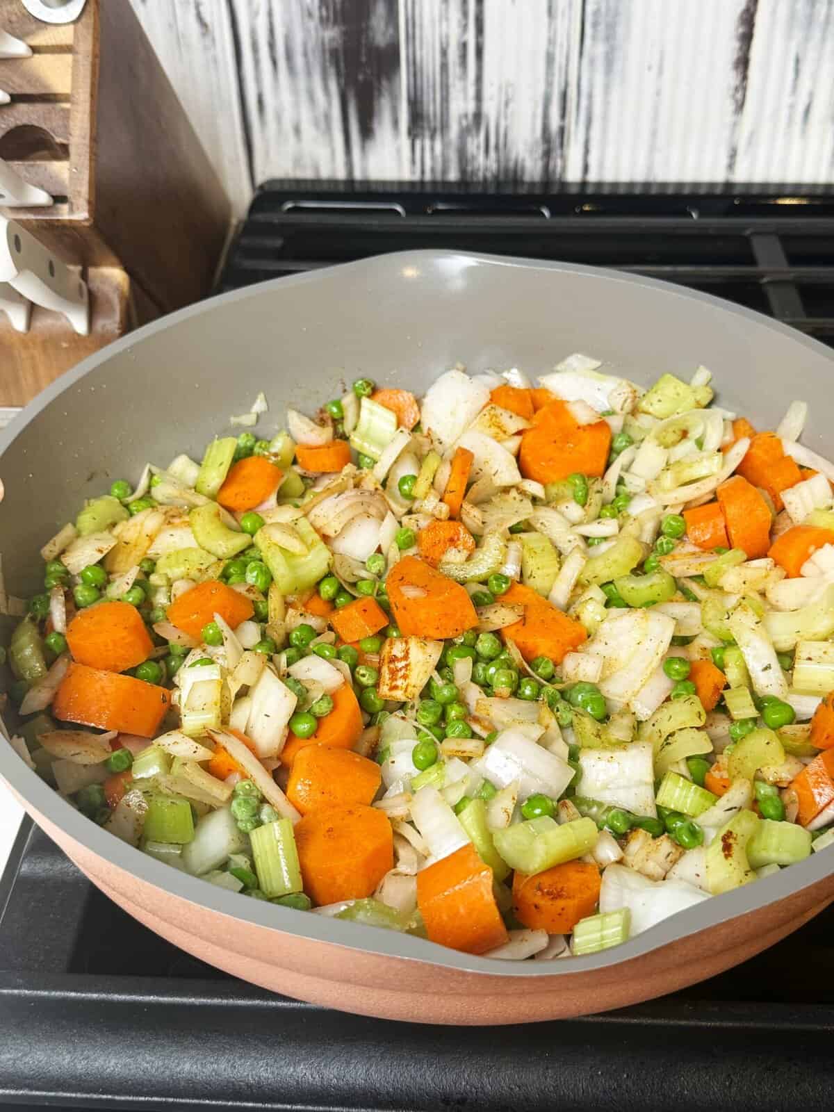vegetables cooking in pan with spices 