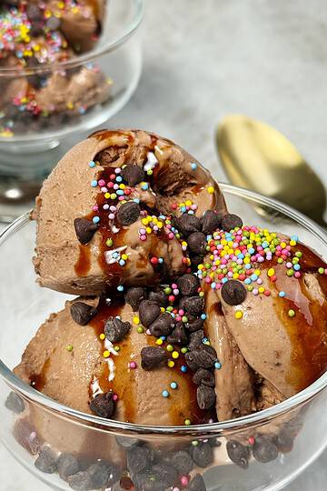 chocolate ninja creami ice cream in a dish with chocolate chips and sprinkles on top