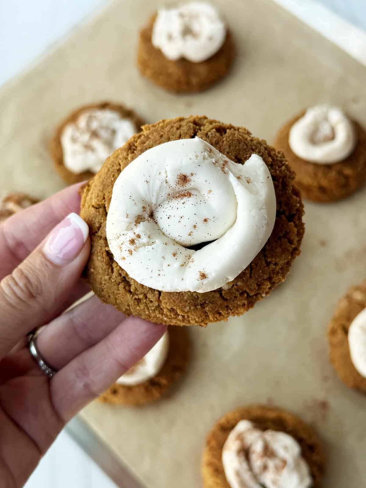 pumpkin crumbl cookie copycat with a swirl of vanilla frosting
