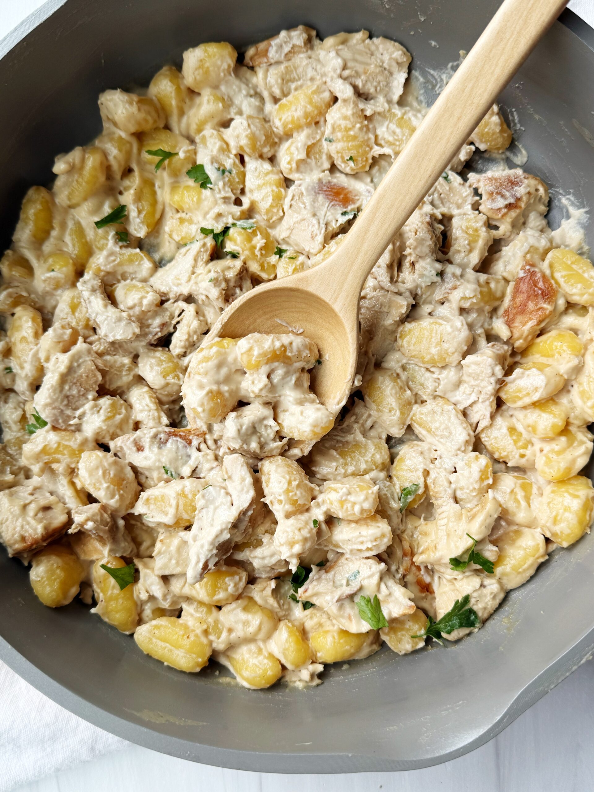 chicken gnocchi alfredo in a pan 