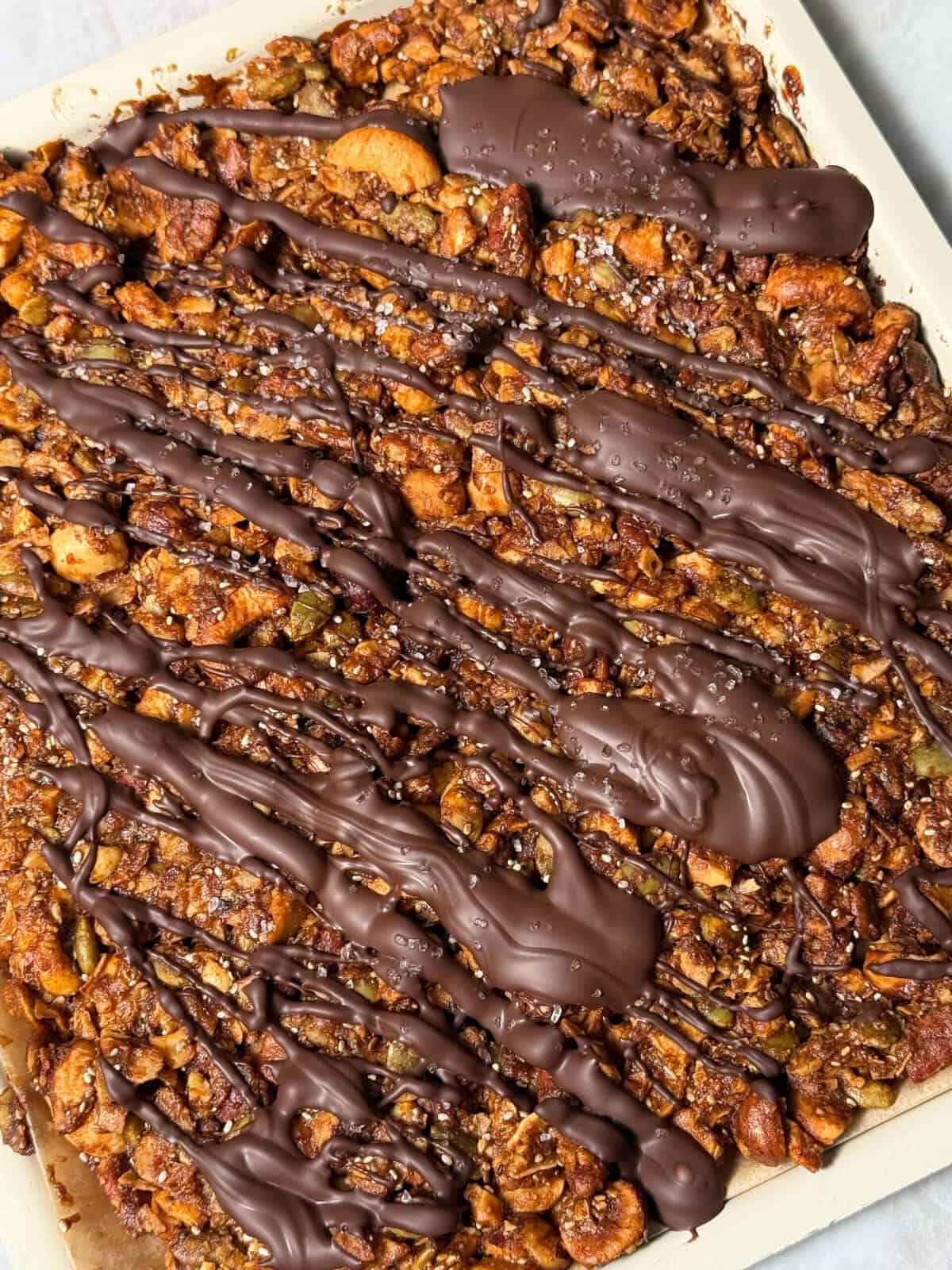 pumpkin spice granola drizzled with chocolate